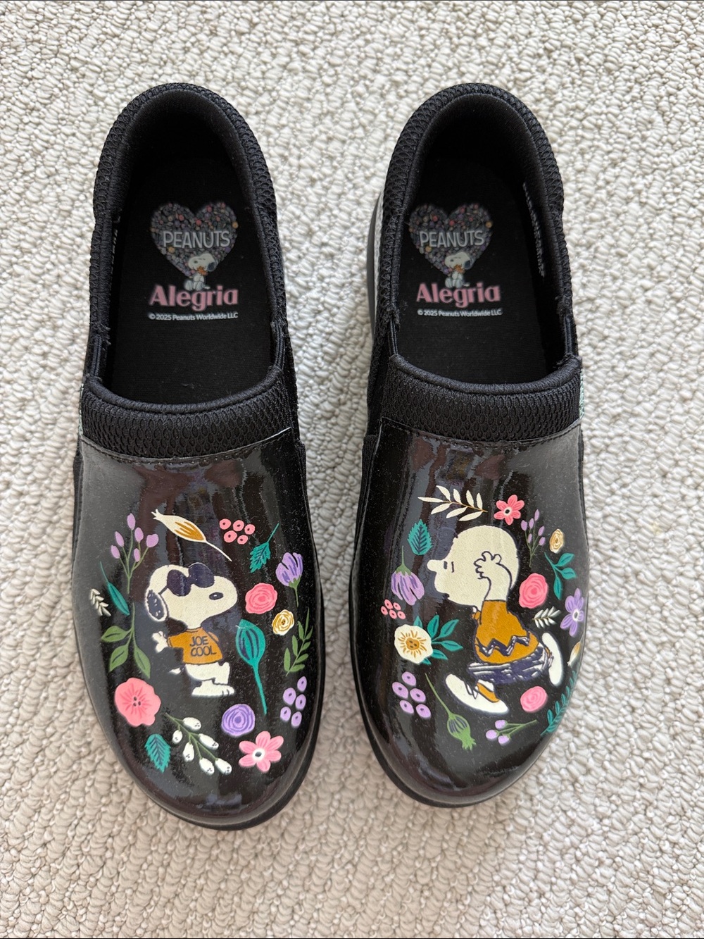 Alegria Kids Black Slip-On Sneakers with Colorful Peanuts Floral Art